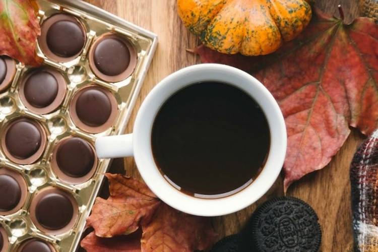 Hot tea, coffee, and flannel on a table