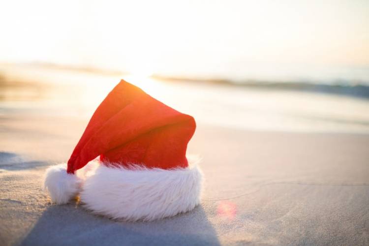 Christmas hat in the sand