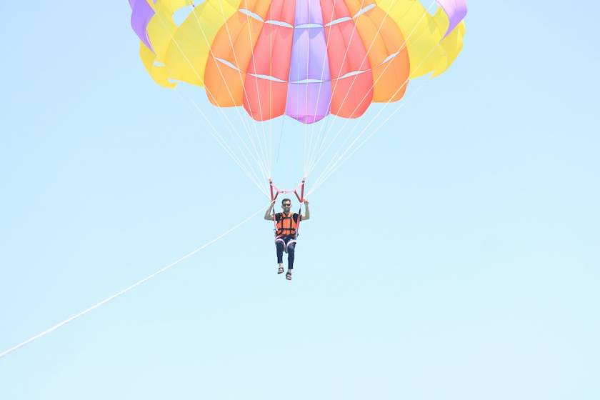 man parasailing in port a